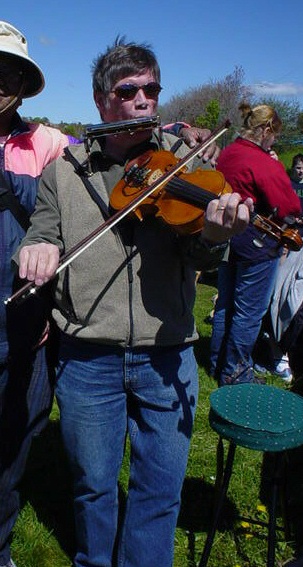 Alastair play a deep melody at the Maynard Lake social during the Environment Week-2005